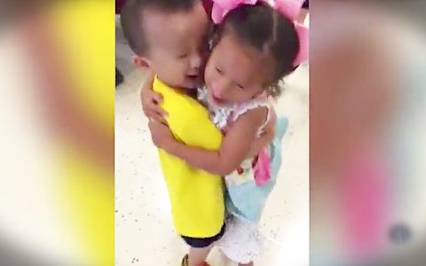 toddler orphans hug each other after being adopted