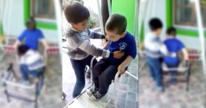 little boy helps best friend