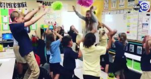 musical morning motivation - teacher raps with students in classroom