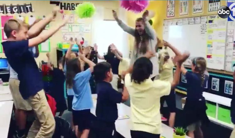 musical morning motivation - teacher raps with students in classroom