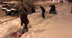 dad pulled over snow shovel wheelchair