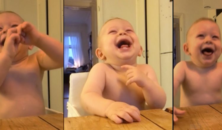 baby laughs at coconut