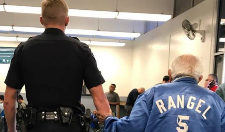 Police Officer Escorts Elderly Man From The Bank_everything inspirational